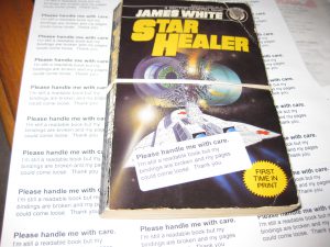 No damaged books are sent to recycle if we can save them.  This book has broken bindings and is beginning to come apart.  We wrap them with a rubber band and add a sticker.  So far no one has complained.  